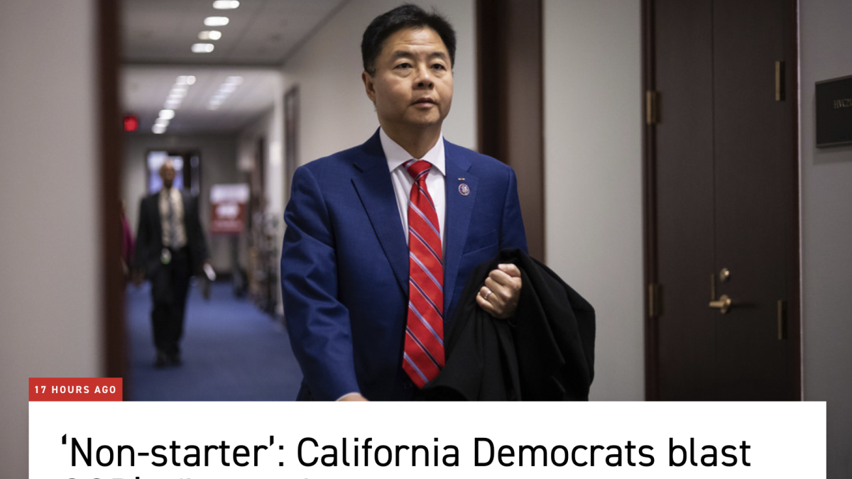 Rep Lieu walks in hallway