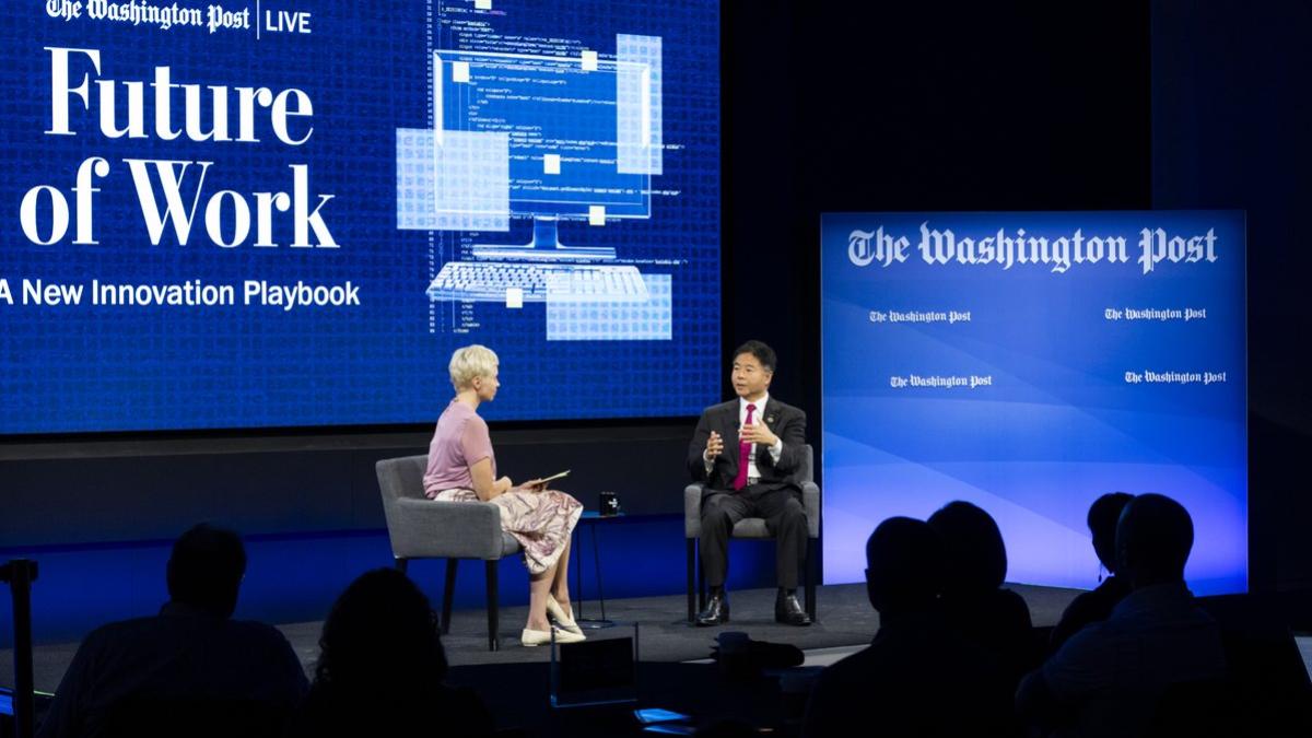 rep lieu seated during interview at Washington Post event with "Future of Work" sign in background