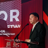 Rep. Lieu speaking at AI award ceremony.