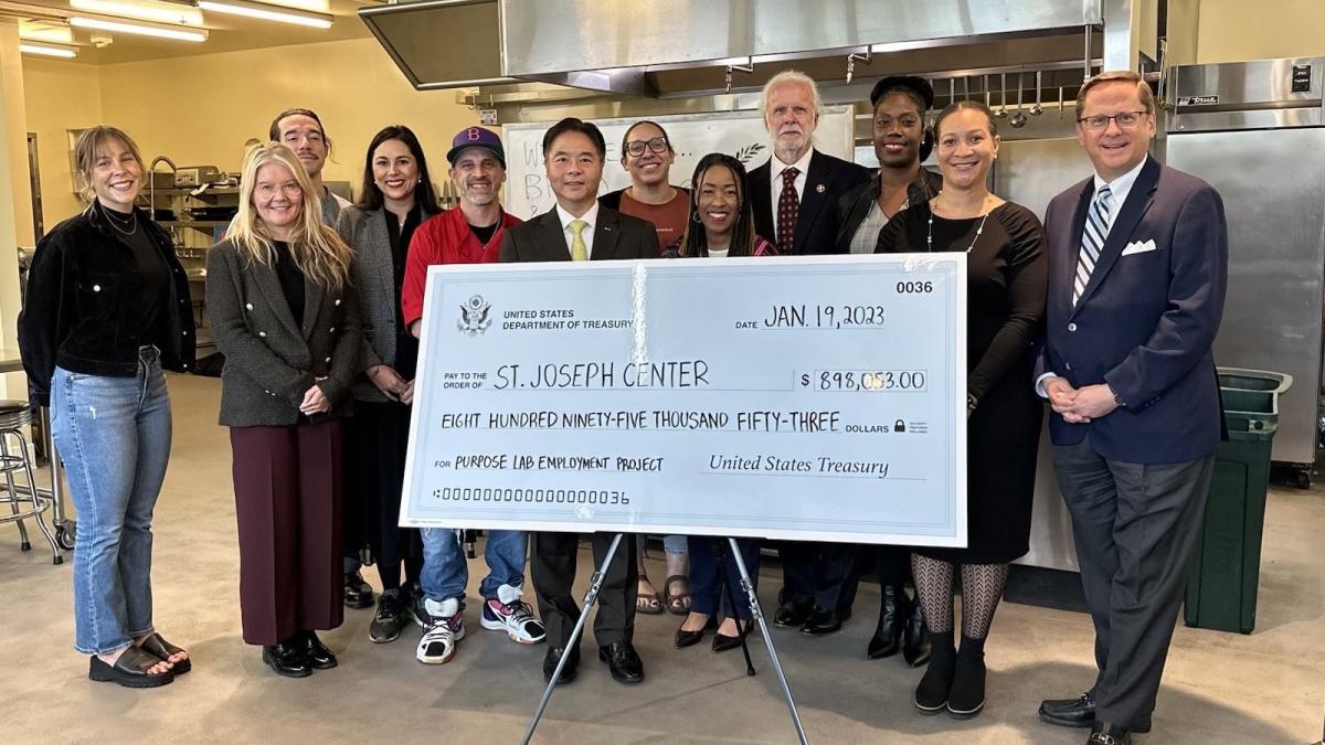 Rep Lieu presents check to St Joseph Center