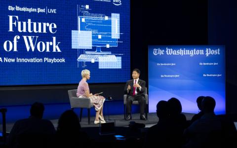 rep lieu seated during interview at Washington Post event with "Future of Work" sign in background